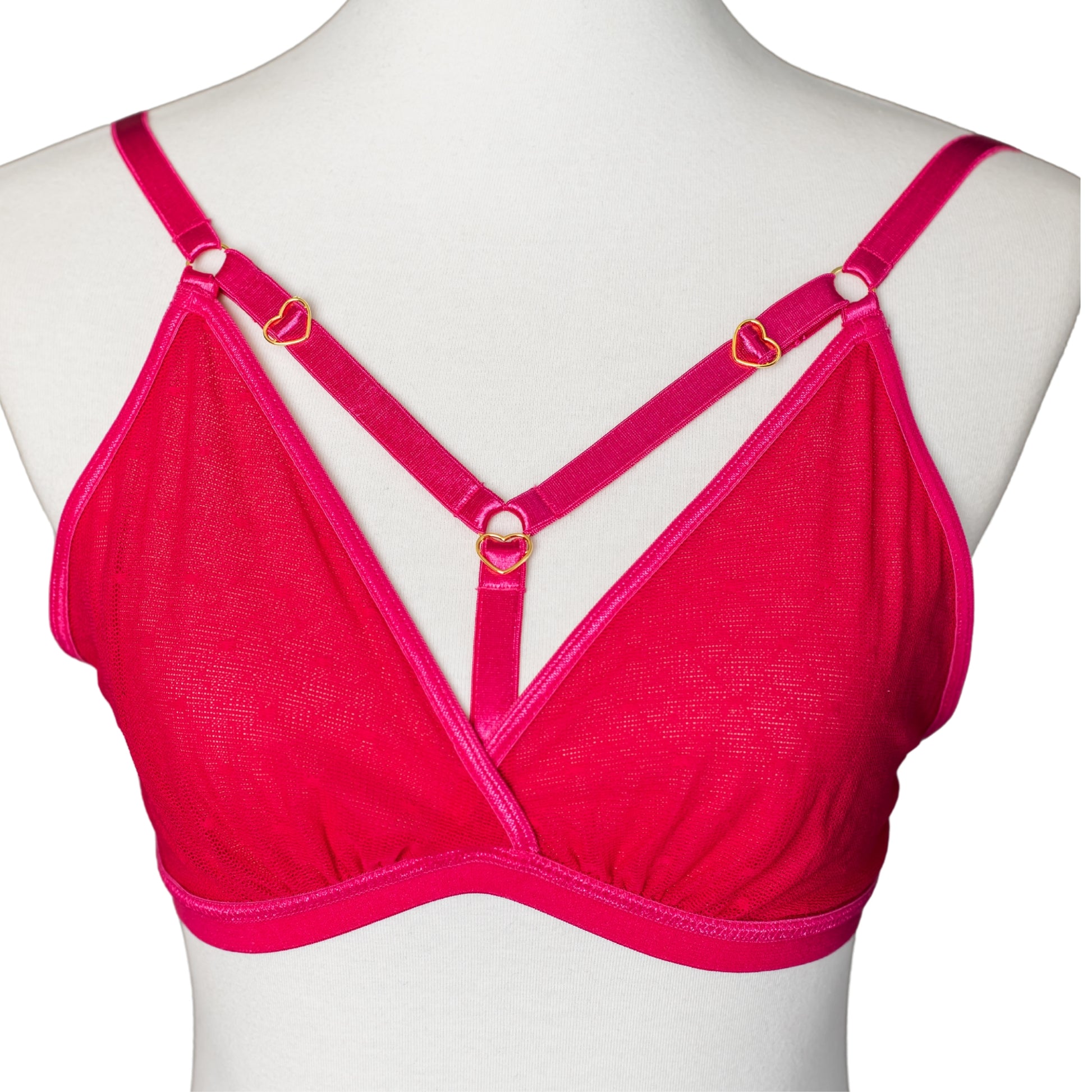 Front view of hot pink bralette with gold heart hardware