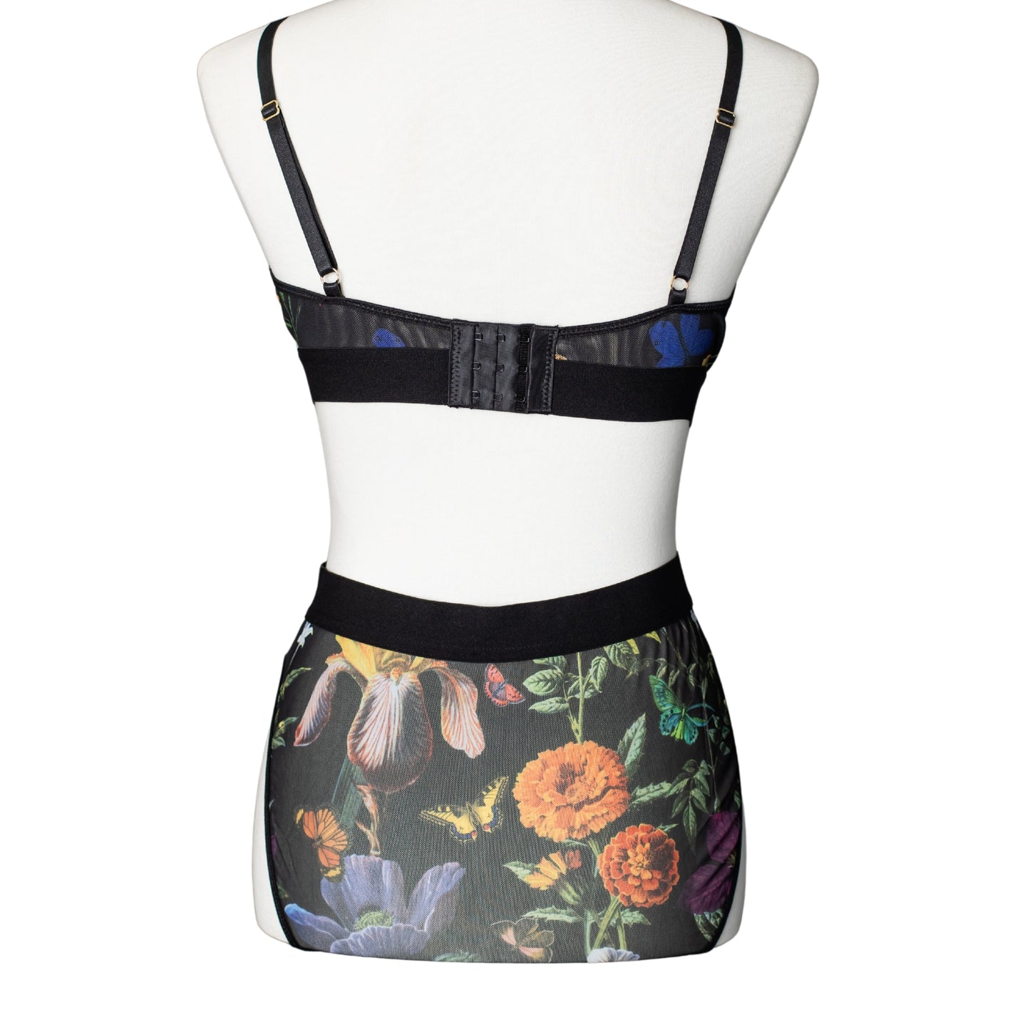 Back view of black floral bra with mesh high-waisted brief panty with high-cut legs