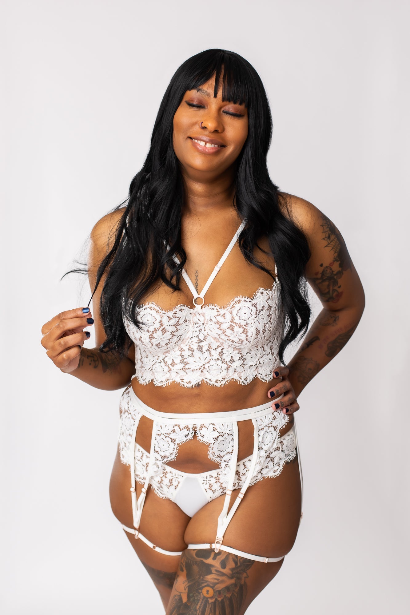 White, lace bridal lingerie set worn by a bride