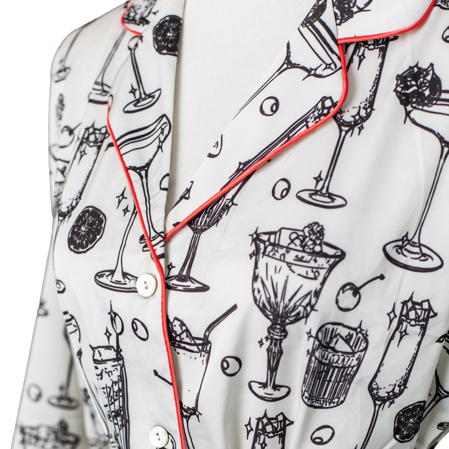 Close-up of satin pajama shirt with a cocktail glass print