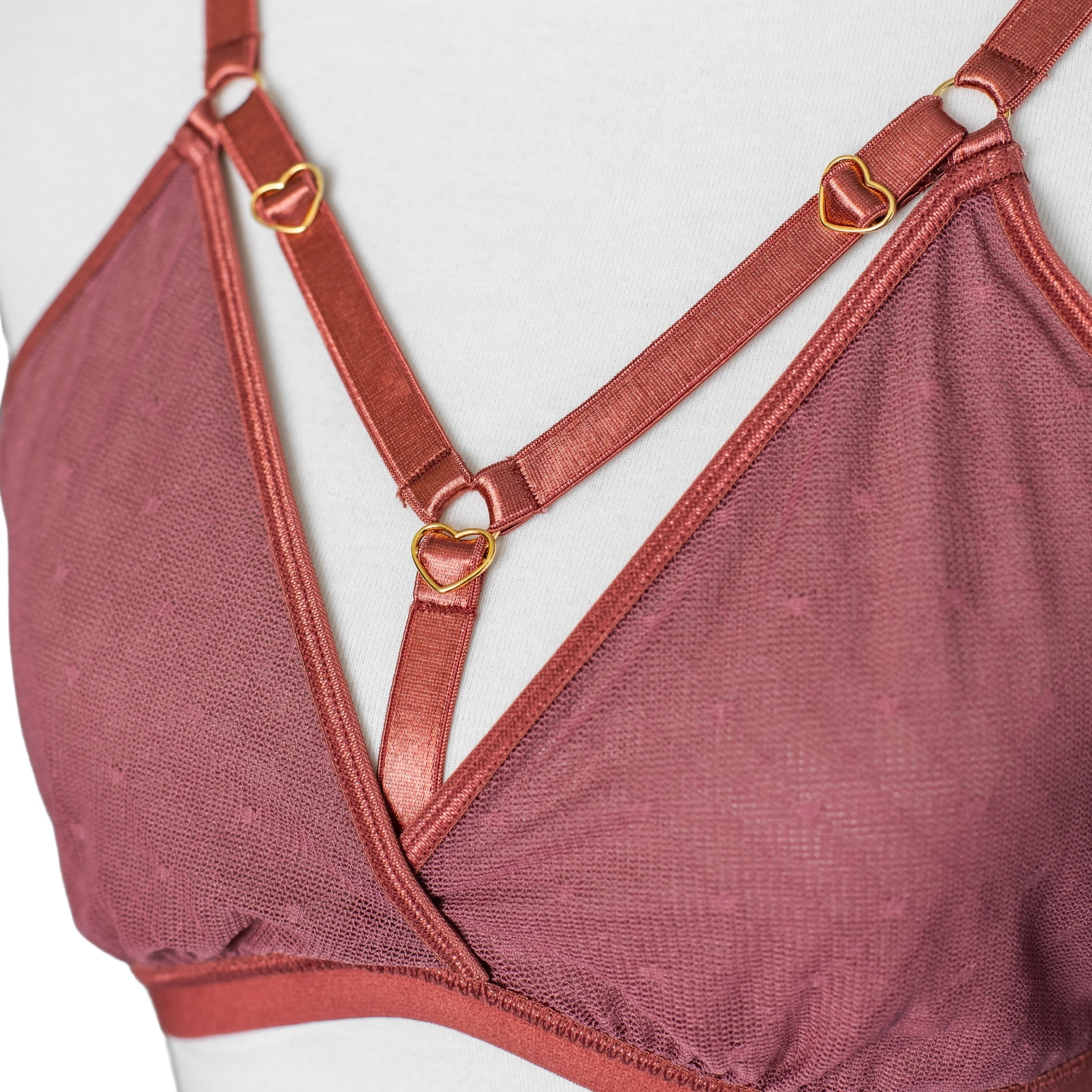 Gold heart hardware details on copper rose bra